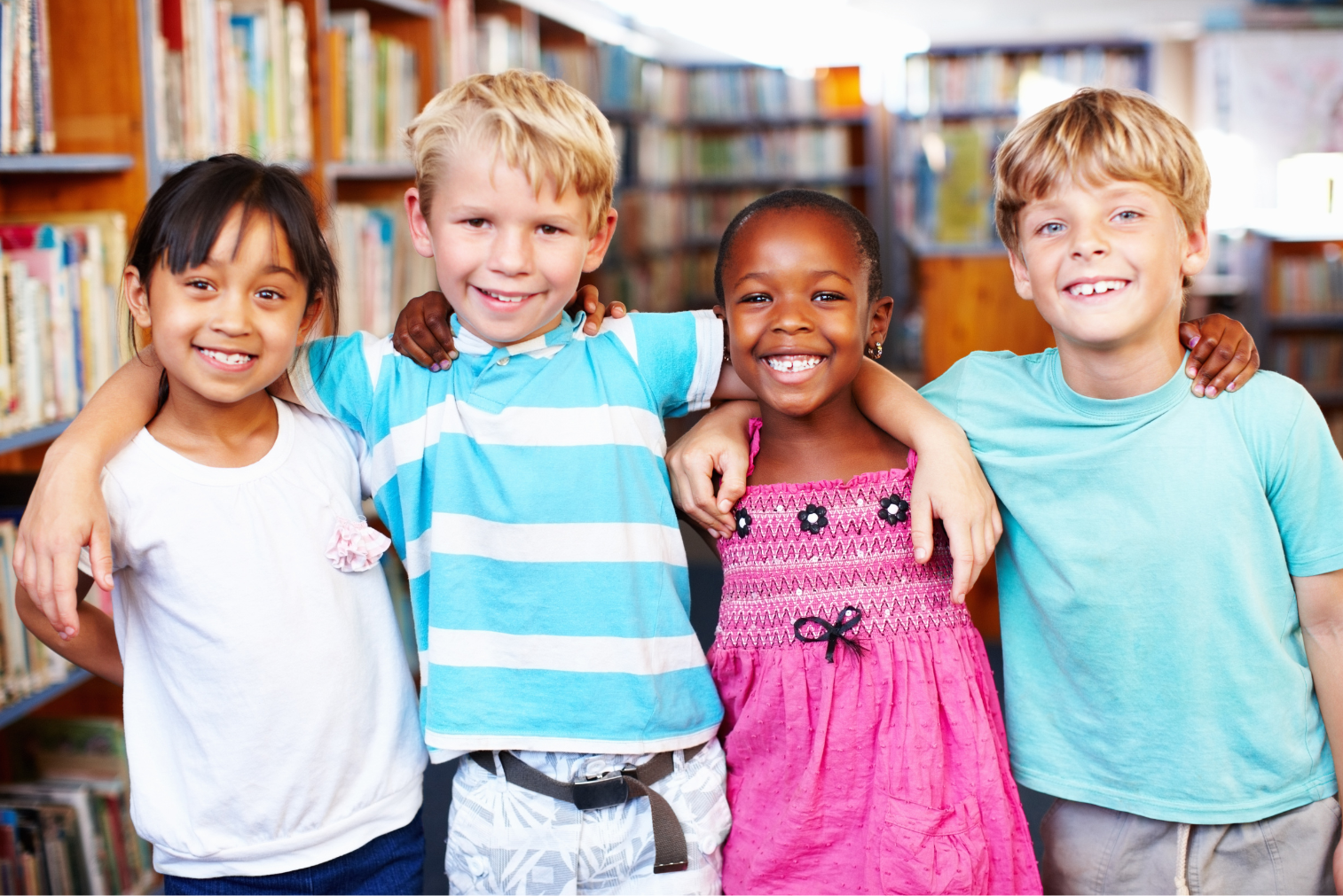 image of children smiling in library